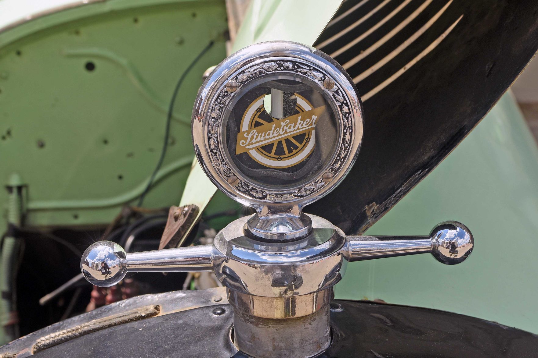 1923 Studebaker radiator cap and heat gauge